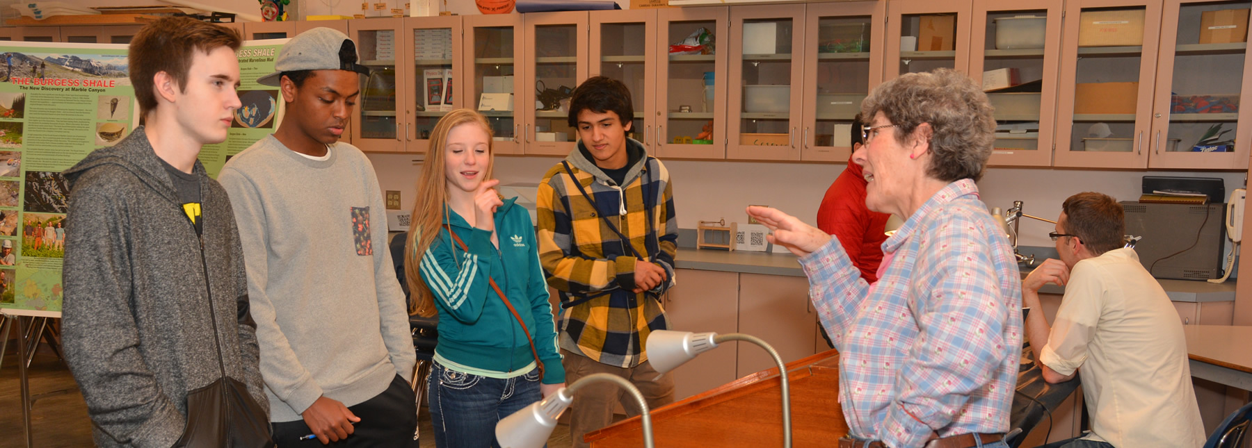 Students speaking with a volunteer during Burgess Shale Nights