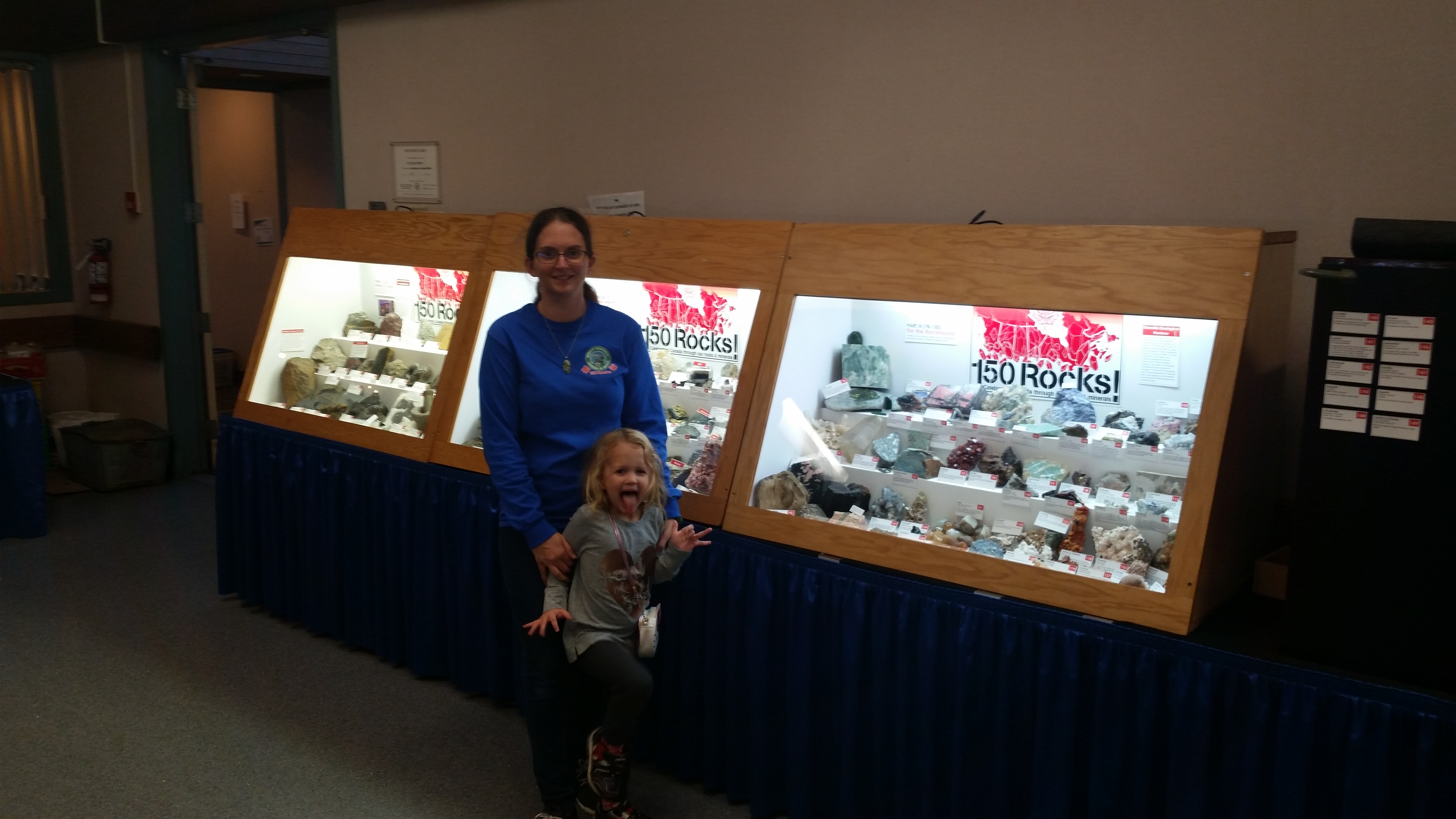 Visitors beside the complete 150 Rocks exhibit at the 2017 Port Moody Rock and Gem Show